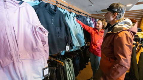 A couple shops at the village Canyon Fever retail location at Solitude Mountain Resort.