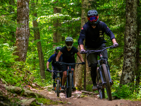 people at mountain bike lessons for downhill mountain biking at stratton bike park in vermont