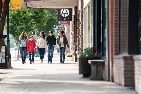 Family walking in town during summer