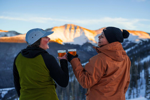 Two women drinking beer at après at Winter Park Resort