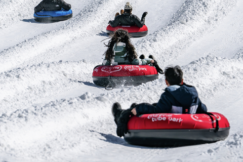 people snow tubing in their own lanes at stratton's tube park