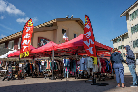 Village tent sale retail buy goods product sidewalk sale shops shopping outerwear labor day layers clothing