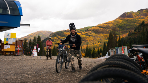 A mountain biker rides Solitude Bike Park in the fall while staying in Solitude village.