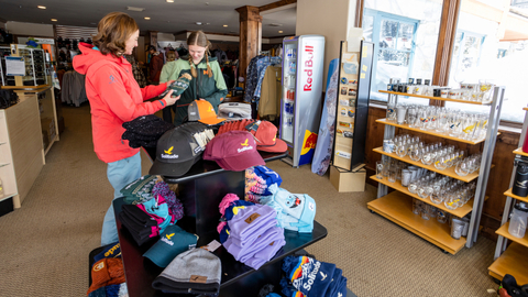 A family looks at a beanie at the village Canyon Fever retail location at Solitude Mountain Resort.
