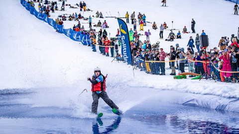 Guests participate in the Pond Skim Beach Party at Solitude Mountain Resort.