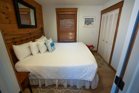 comfortable guest bedroom with natural wood details at 34 saw mill vacation rental at stratton mountain resort