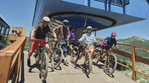 Mountain bikers ride the chairflit at Solitude Mountain Resort