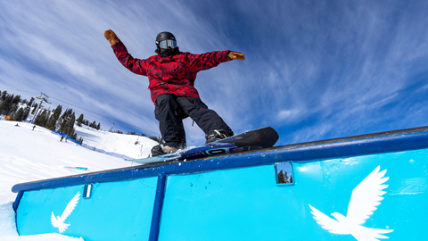 A snowboarder rides a rail in Solitude's Main Street Terrain Park