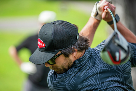 golf lifestyle course club boys friends guests smile laugh green apron pro shop music green fairway put drive chip
