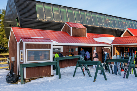 guests accessing the snowboard and ski storage area at the ski butlers slopeside valet at stratton mountain resort