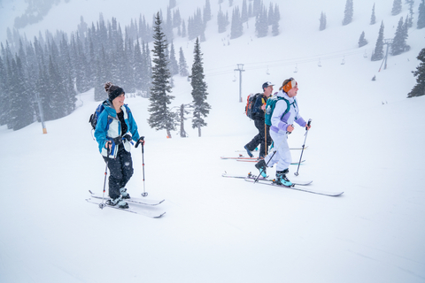 Four skiers skin up the slope at Crystal Mountain