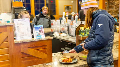 Guests enjoy the lasagna dinner before the Torchlight Parade & Fireworks Show at Solitude Mountain Resort.