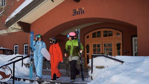 Friends walking through Solitude Village while staying at The Inn at Solitude.
