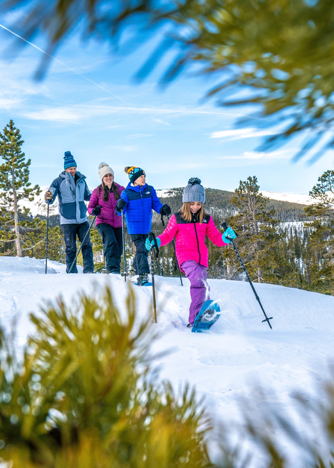 Family snowshoeing in the Rocky Mountain at Winter Park Ski Resort Colorado