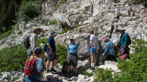 Group learns about rocks on a geology tour at Solitude Mountain Resort.