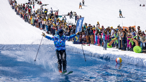 Guests participate in the Pond Skim Beach Party at Solitude Mountain Resort