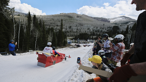 Two guests participate in Solitude Mountain Resorts Cardboard Derby.
