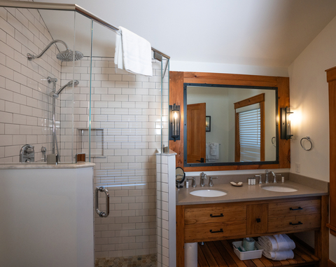 dual sink vanity and glass shower with subway tile at 34 saw mill vacation rental at stratton mountain resort