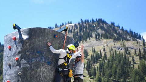 Climber Scales Climbing Wall at Crystal Mountain