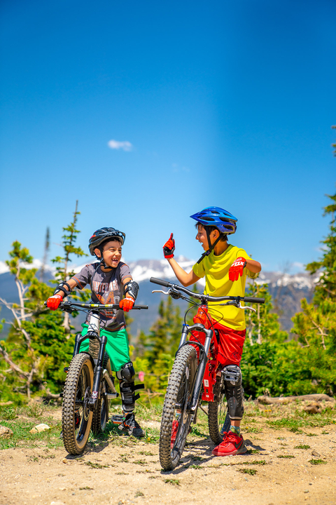 Two children biking in Winter Park Colorado