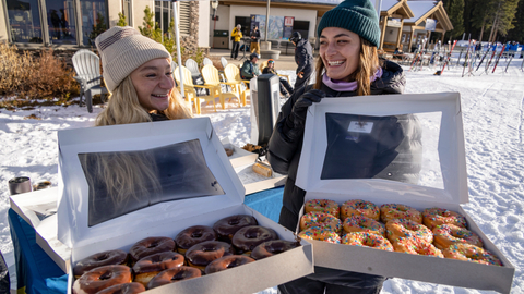 Employees hand out donuts on opening day at Solitude Mountain Resort.