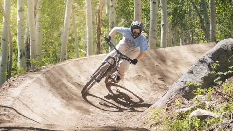A mountain biker banks a berm at Solitude Bike Park