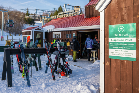 guests dropping off gear at the ski butlers slopeside valet, ski and snowboard storage area at stratton mountain 