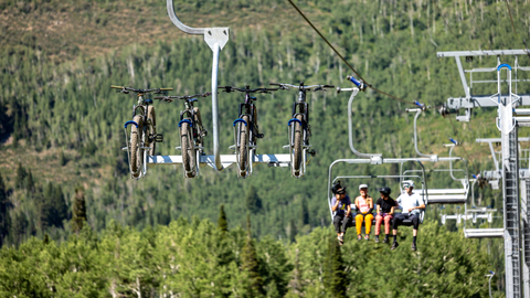 Friends ride Moonbeam Express while biking at Solitude Bike Park.