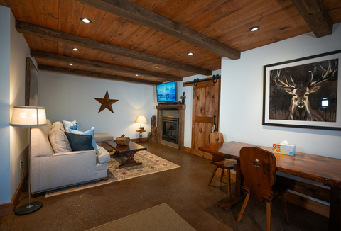 cozy lower level with fireplace and writing desk at 34 saw mill vacation rental at stratton mountain resort