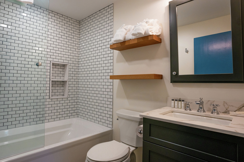 updated bathroom with subway tile and built-in shelves at 22 north branch vacation rental in stratton