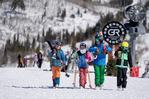 Kids in a ski school lesson