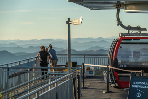 two employees look out over the Cascades