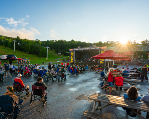 CONCERTHarvest and Rust Neil Young cover band show audience crowd summer evening rain pretty