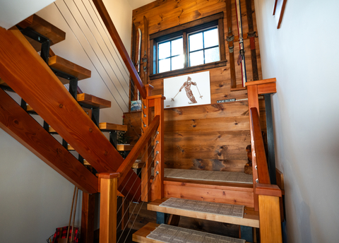 detail of wood and metal staircase at 34 saw milla vacation rental, showcasing rustic alpine charm near stratton mountain