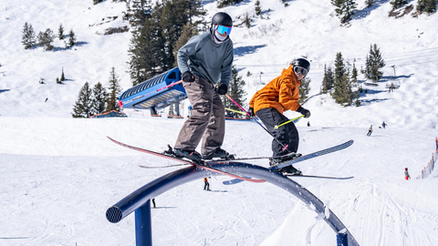 two skiers ride the rails in the Main Street Terrain Park at Solitude