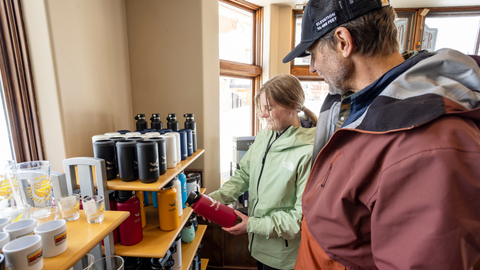 A father and daughter look at gifts in the village Canyon Fever retail location while shopping at Solitude Mountain Resort.