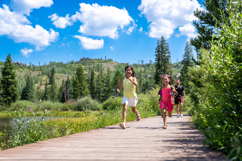 Kids running with fishing poles