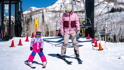 A family skis and rides the chairlift at Solitude Mountain Resort