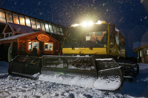 Ride up in a snowcat and have dinner at the mid-mountain lodge