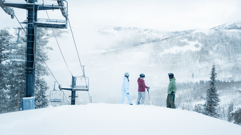 Friends powder ski and snowboard at Solitude Mountain Resort.