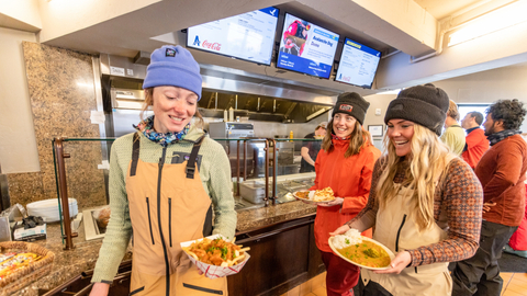 Friends pickup their lunch orders at Roundhouse at Solitude Mountain Resort. 