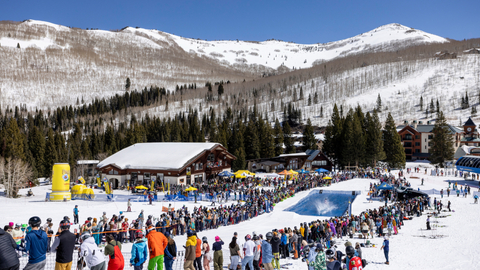 Guests participate in the Pond Skim Beach Party at Solitude Mountain Resort