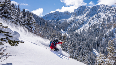 Patrick Spence skiing powder in Honeycomb Canyon with Fantasy Ridge in the background