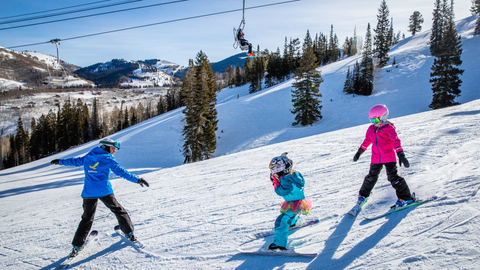 Young children in a beginner ski lesson at Solitude Mountain Resort