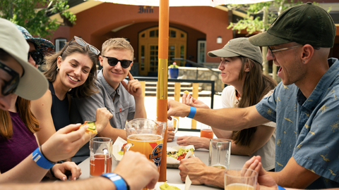 People enjoying food and drinks at The Thirsty Squirrel at Solitude Mountain Resort