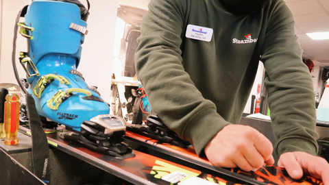 Man Adjusting Ski
