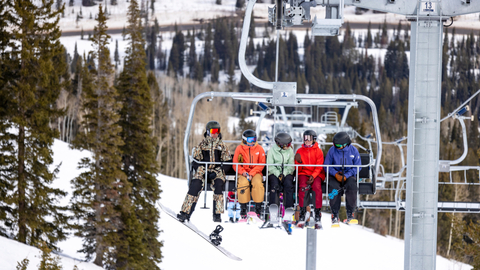 Friends ride Eagle Express while skiing at Solitude Mountain Resort.