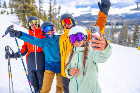 a group of friends take a selfie before skiing at Winter Park Resort