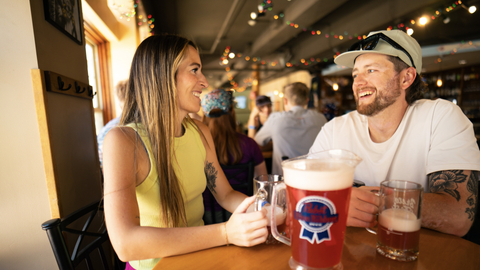 People enjoying drinks at The Thirsty Squirrel at Solitude Mountain Resort