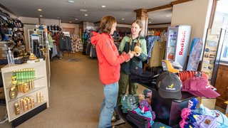 A family shops at the village Canyon Fever retail location at Solitude Mountain Resort.